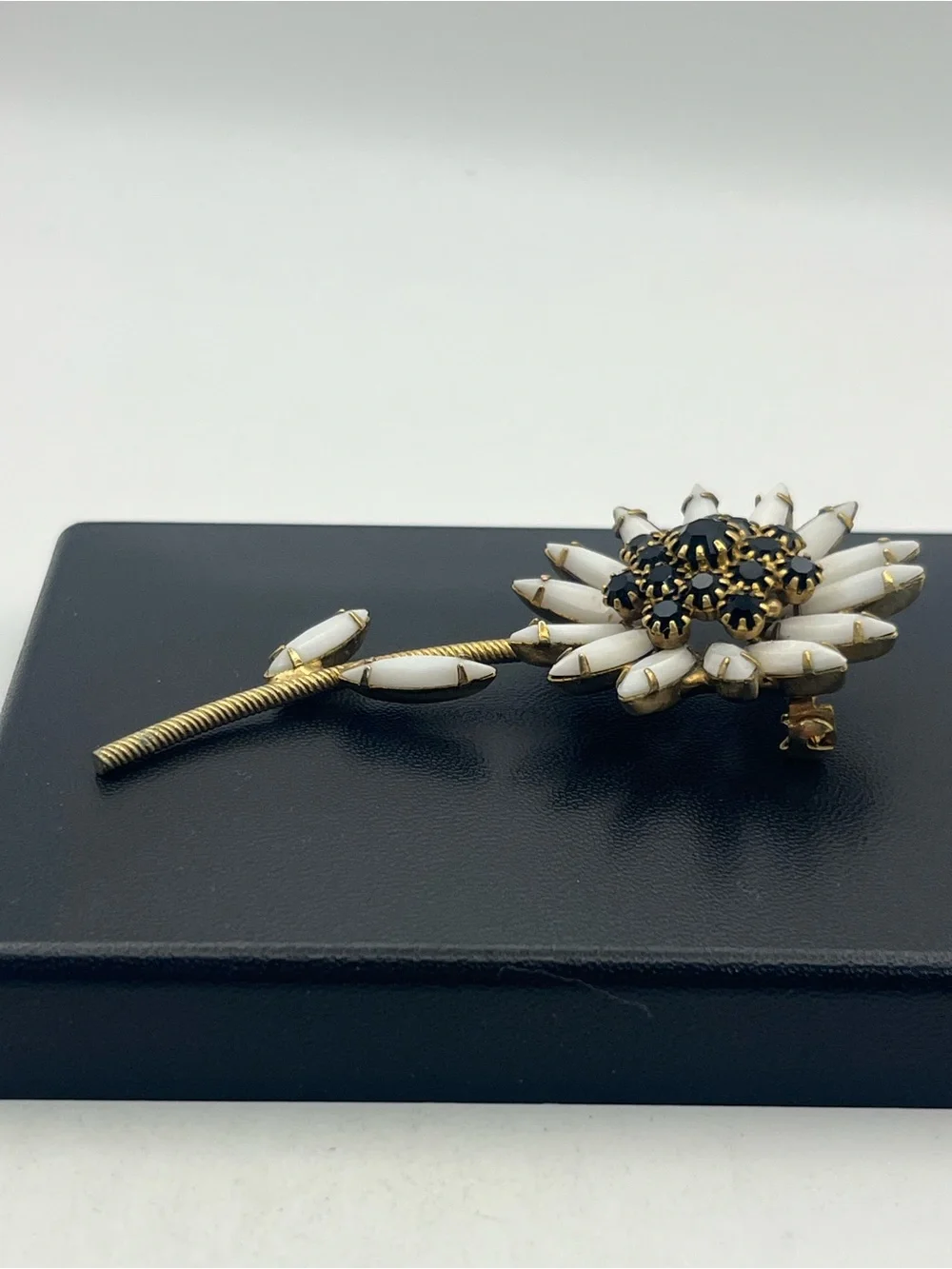 White milk glass black rhinestone daisy flower gold tone brooch pin vintage